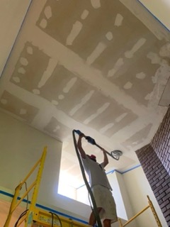 Drywall repair in progress in a Baldwin County home